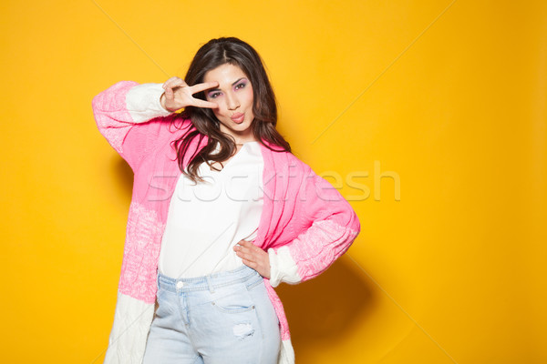 Dziewczyna różowy kurtka dwa palce żółty Zdjęcia stock © dmitriisimakov