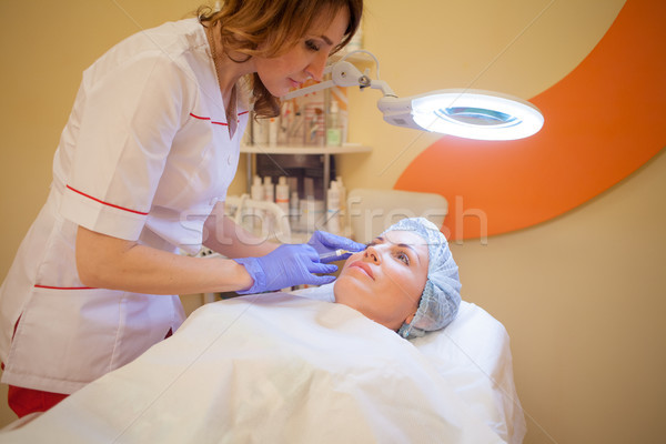 Arts lip patiënt injectie spuit spa Stockfoto © dmitriisimakov