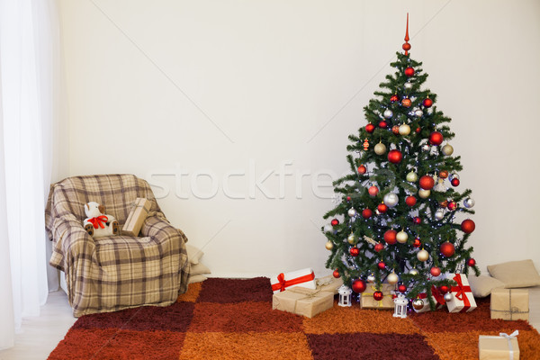 Christmas tree on new year's Eve in a white room with Christmas gifts Stock photo © dmitriisimakov