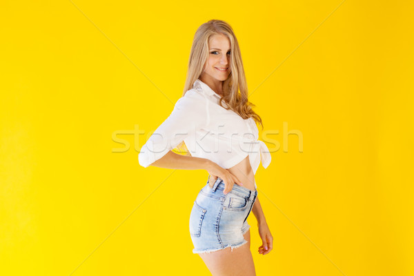 blonde girl with blue eyes posing portrait shorts Stock photo © dmitriisimakov