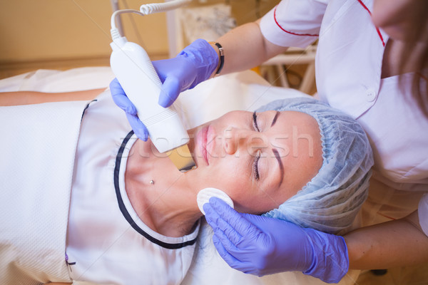 doctor cosmetologist makes the procedure a woman on the face of the Spa Stock photo © dmitriisimakov