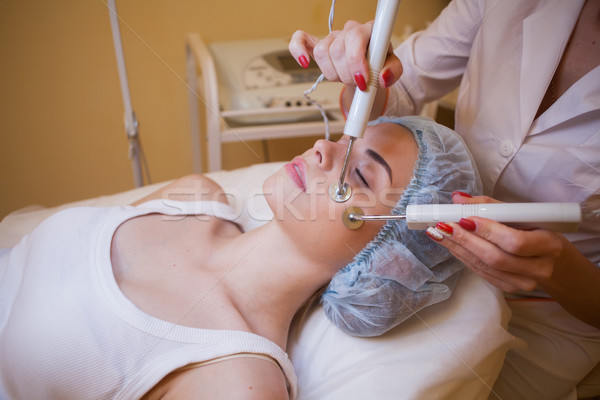 Cosmetology doctor makes facial procedures Stock photo © dmitriisimakov