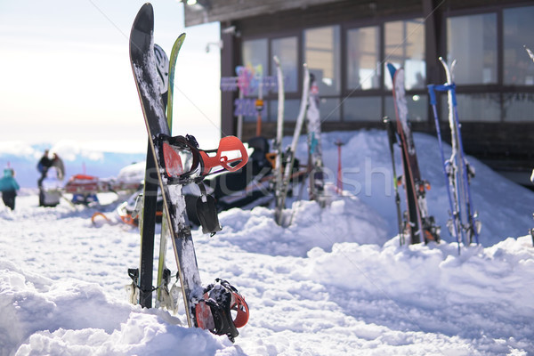 Snow in the ski resort of sports equipment skis and snowboard Stock photo © dmitriisimakov