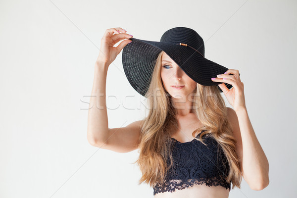 blonde girl with blue eyes a hat with a brim on a white background Stock photo © dmitriisimakov