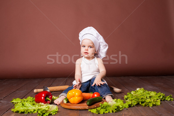 boy chef prepares carrots, pepper, Tomato Cucumber Stock photo © dmitriisimakov