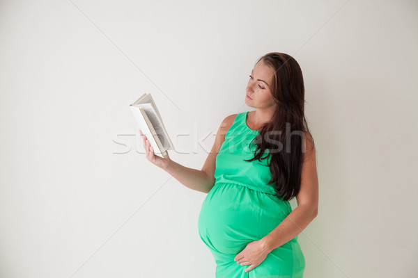 pregnant woman reading a book before childbirth Stock photo © dmitriisimakov