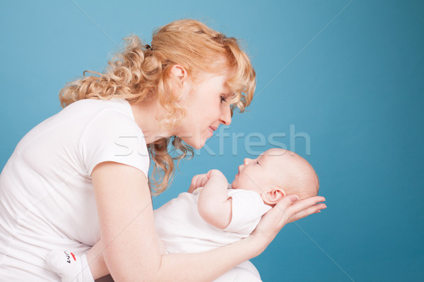mom looks lovingly at baby son Stock photo © dmitriisimakov