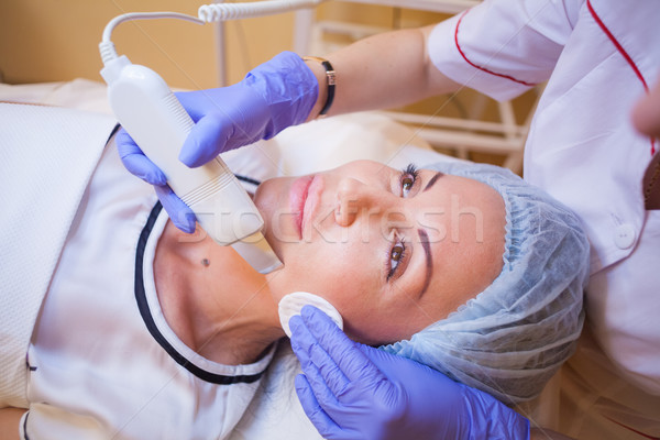 doctor cosmetologist makes the procedure a woman on the face of the Spa Stock photo © dmitriisimakov