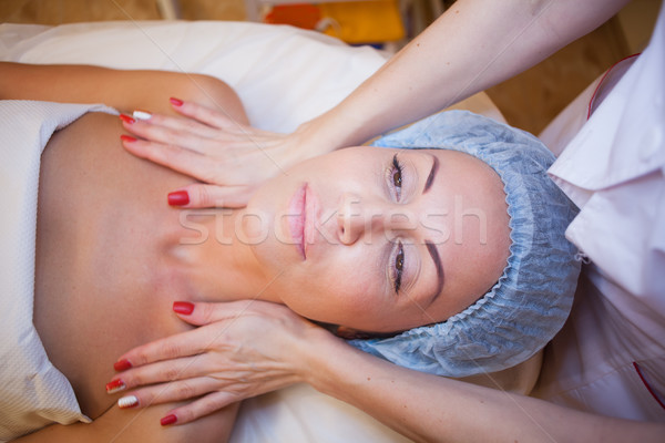 Cosmetology Spa woman doing facial massage Stock photo © dmitriisimakov