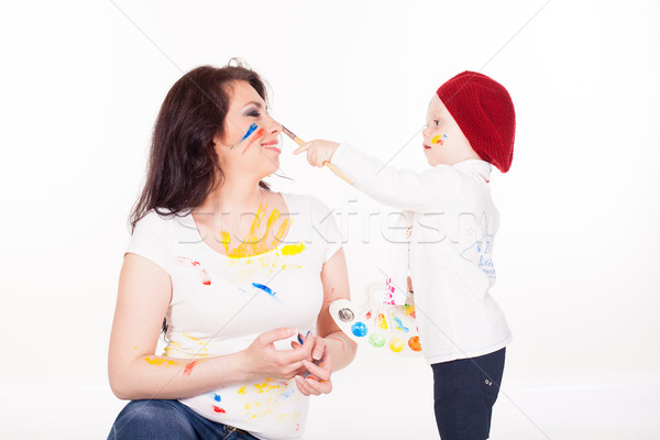 mother and little boy paints when painted Stock photo © dmitriisimakov