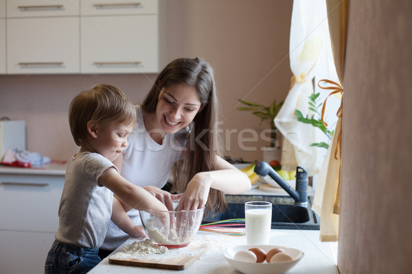 mother and son prepare pie with flour Stock photo © dmitriisimakov