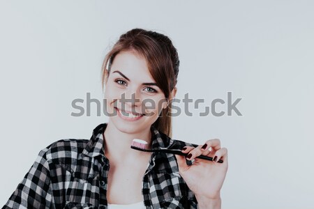 the girl in the bathtub with a toothbrush teeth smile Stock photo © dmitriisimakov