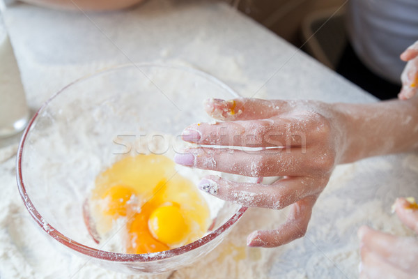 Stock photo: mother and young son prepare pie in the kitchen