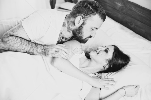 a man with a woman in the morning woke up in a bedroom dream Stock photo © dmitriisimakov