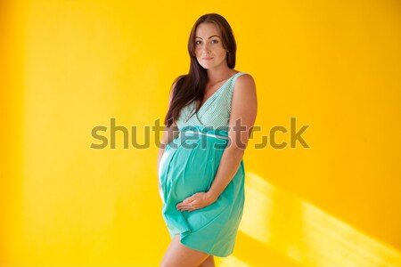 Terhes nő szülés citromsárga kéz baba test Stock fotó © dmitriisimakov