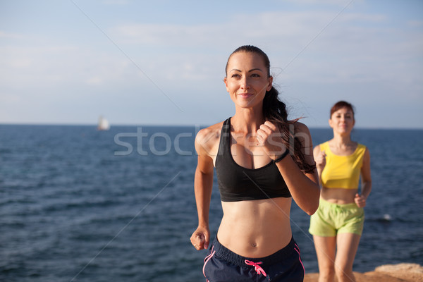 girls play sports jog on the beach Stock photo © dmitriisimakov