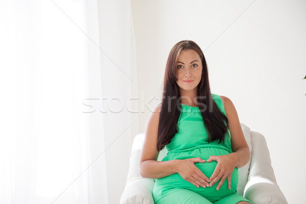 Terhes nő szülés fehér kanapé nő boldog Stock fotó © dmitriisimakov