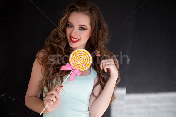 Nő édes cukorka nyalóka étel ahogy Stock fotó © dmitriisimakov