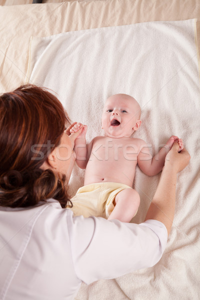 the little boy baby mother doing massage hands and legs Stock photo © dmitriisimakov