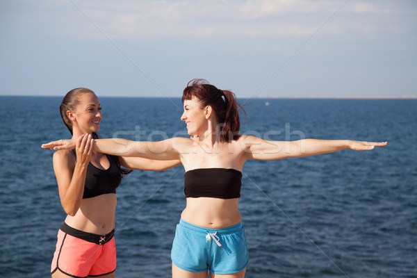 Stock photo: fitness instructor teaches a woman to play sports