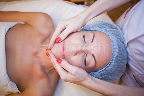 Cosmetology Spa woman doing facial massage Stock photo © dmitriisimakov