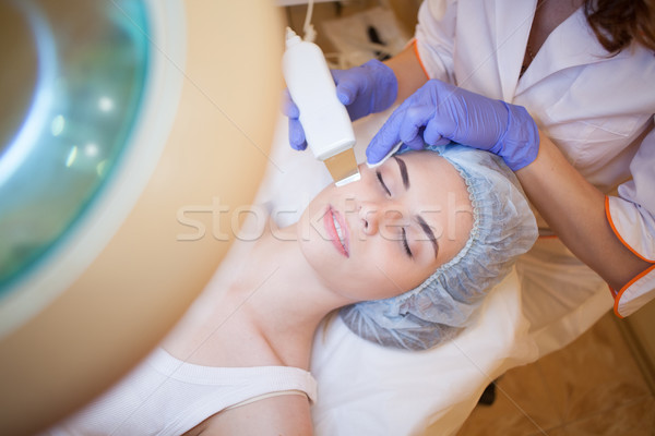 Cosmetology doctor makes the procedure a woman face cleaning Stock photo © dmitriisimakov