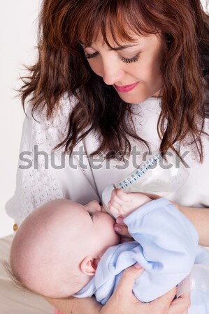 mom feeding babe the son of breast milk Stock photo © dmitriisimakov