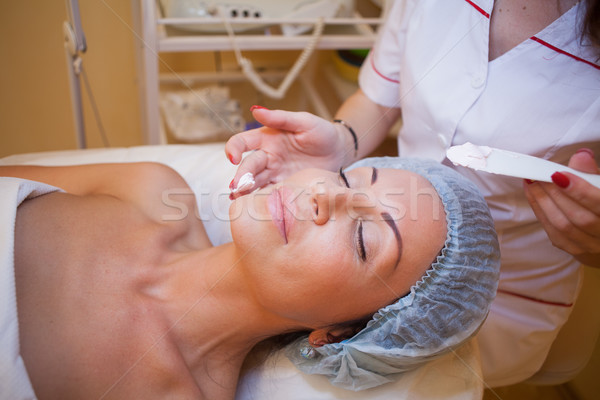 Stock photo: Cosmetology treatments on face moisturizer