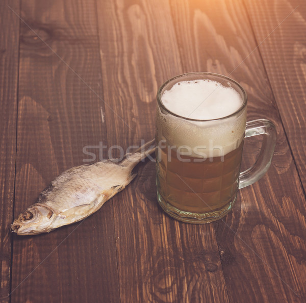 One fish with frothy beer Stock photo © dmitroza