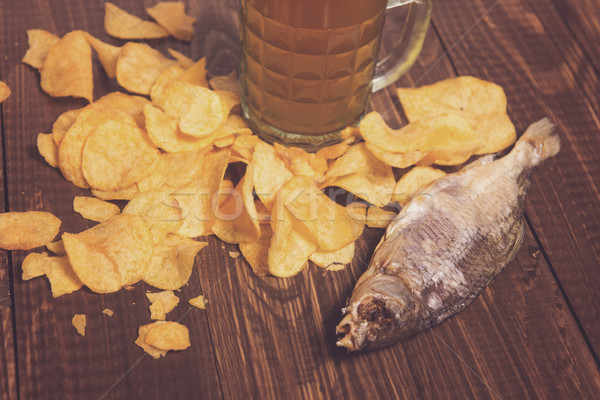 Dried fish, beer and chips Stock photo © dmitroza