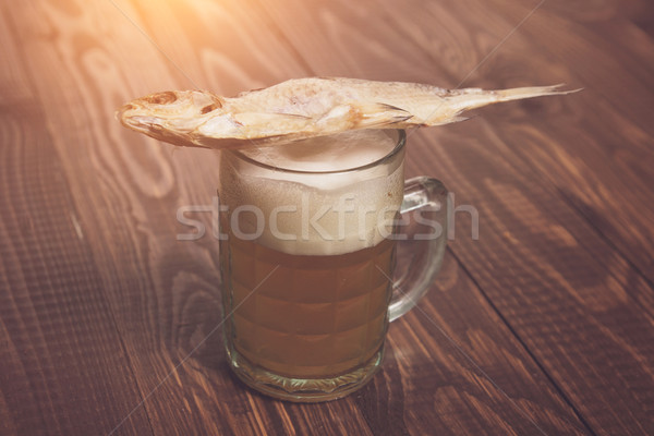 Fish on frothy beer Stock photo © dmitroza