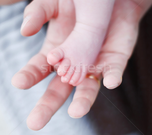 babies foot and hand of man Stock photo © dmitroza