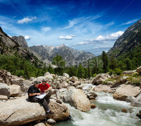 Stock photo: Hikers with map