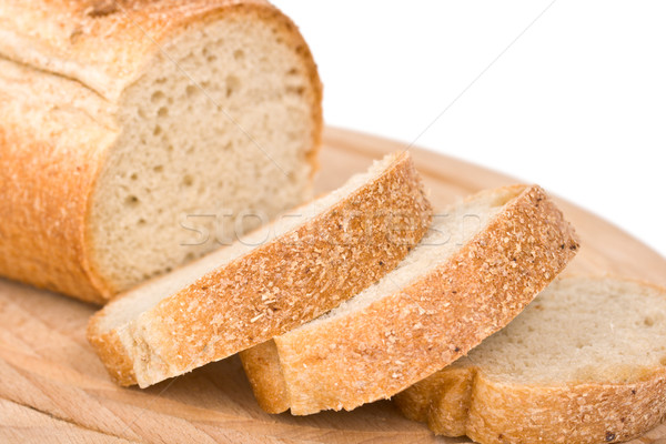 Sliced bread on wooden plate Stock photo © dmitry_rukhlenko