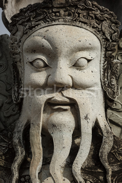 Wat Pho stone guardian face close up, Thailand Stock photo © dmitry_rukhlenko