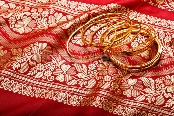 Indian sari with golden bangles Stock photo © dmitry_rukhlenko