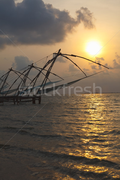 Chinese fishnets on sunset. Kochi, Kerala, India Stock photo © dmitry_rukhlenko