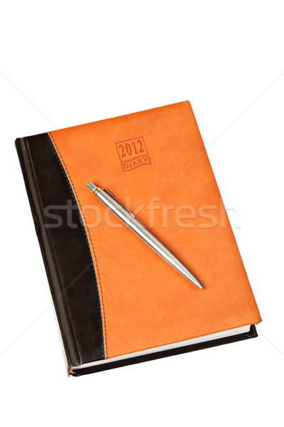 Diary and pen on table isolated Stock photo © dmitry_rukhlenko