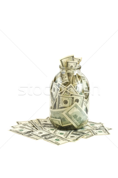 Hundreds of dollars stuffed in a glass jar Stock photo © dmitry_rukhlenko