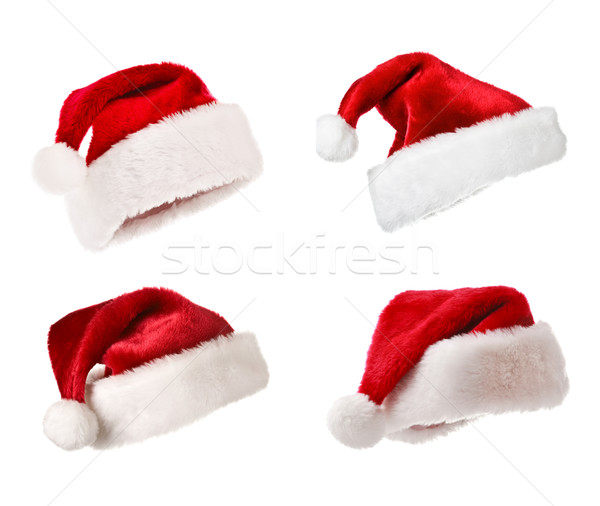 Santa hats isolated on white Stock photo © dmitry_rukhlenko
