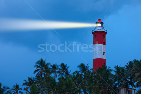 Lighthouse in night with light beam Stock photo © dmitry_rukhlenko
