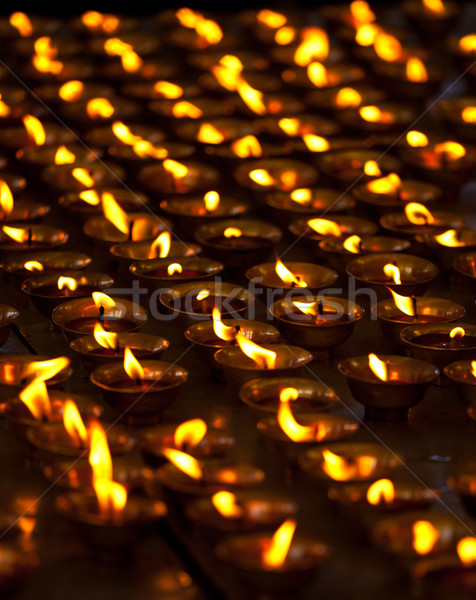 Burning candles in Buddhist temple. McLeod Ganj, Himachal Prades Stock photo © dmitry_rukhlenko