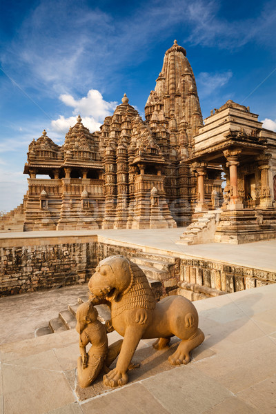 King and lion fight statue and Kandariya Mahadev temple Stock photo © dmitry_rukhlenko