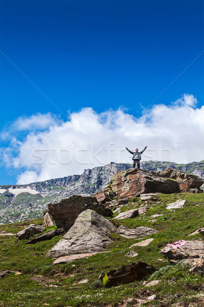 Happy tourist in mountains Stock photo © dmitry_rukhlenko