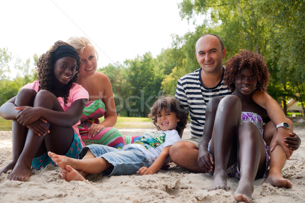Happy fosterfamily on the beach Stock photo © DNF-Style