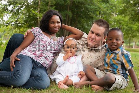 Multicultural família sofá africano sessão jardim Foto stock © DNF-Style