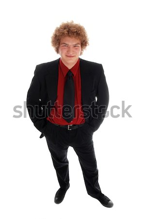 Om de afaceri tineri în picioare costum negru alb fundal Imagine de stoc © dnsphotography