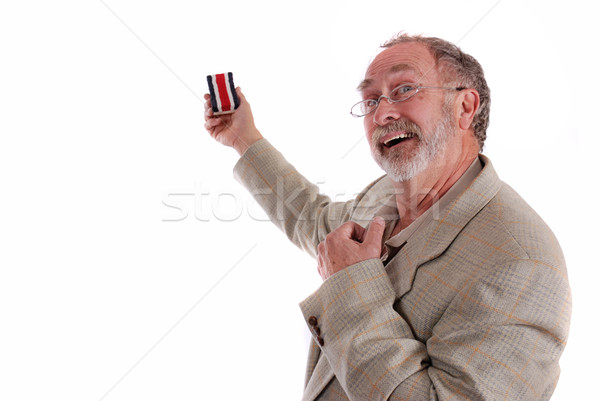 Stock photo: Comical professor gesturing with white board eraser