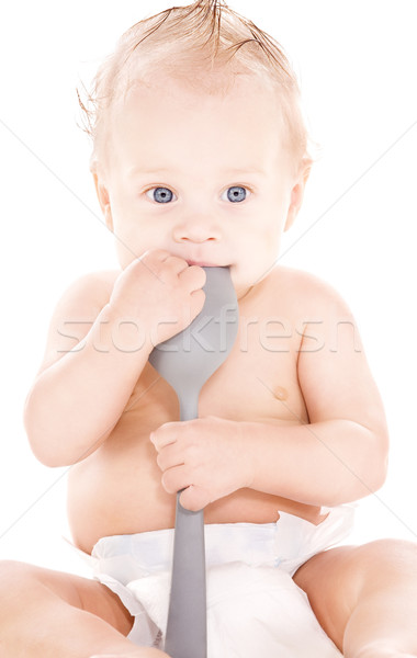 baby boy with big spoon Stock photo © dolgachov