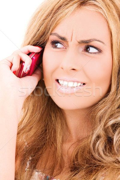 unhappy woman with cell phone Stock photo © dolgachov